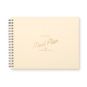 Spiral bound weekly meal planning organizer book with script font that reads " weekly meal plan and shopping list" The book is beige with a brown font.