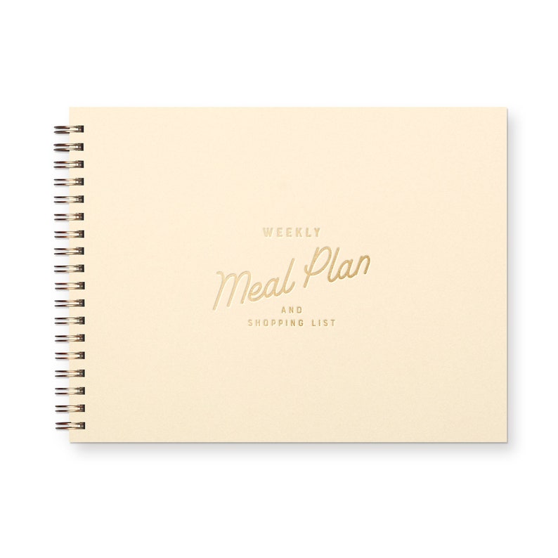 Spiral bound weekly meal planning organizer book with script font that reads " weekly meal plan and shopping list" The book is beige with a brown font.