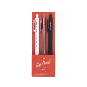Be bold pen set of three pens in Canyon red paper packaging. Pens from left to right are White (Red lettering), Rose Gold (White Lettering), Black (White Lettering).