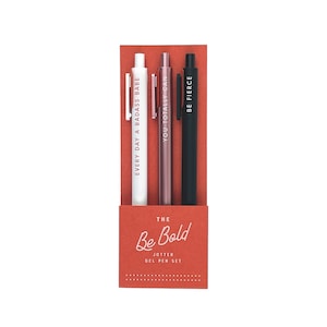 Be bold pen set of three pens in Canyon red paper packaging. Pens from left to right are White (Red lettering), Rose Gold (White Lettering), Black (White Lettering).