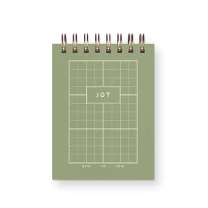 May include: A small, olive-green notepad with a grid pattern and the word "JOT" in a white rectangle. The notepad has a spiral binding at the top and measurements in inches along the bottom. The grid is divided into squares.
