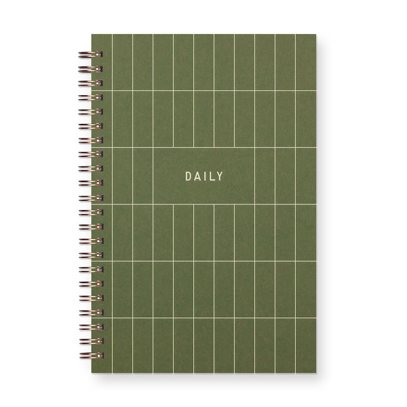 Small Spiral bound planner with grid on cover that reads "daily"