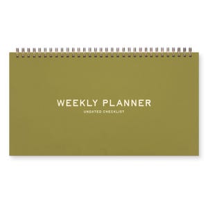 May include: A rectangular weekly planner with a spiral binding. The cover is olive green with the words "WEEKLY PLANNER" and "UNDATED CHECKLIST" in white. The planner is designed to lay flat.