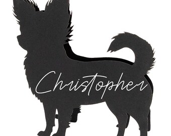 May include: A black silhouette of a Chihuahua dog with the name "Christopher" in white script across its body. The dog is depicted in a standing pose with its tail curled upwards. The image is set against a white background.