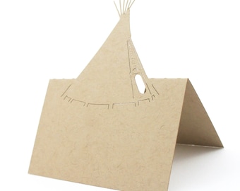 May include: A folded, tan paper card shaped like a Native American teepee. The teepee design is cut out, revealing a detailed structure. The card is standing upright, with a blank space for a message.