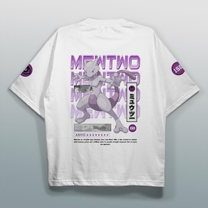 May include: White t-shirt featuring a purple Mewtwo graphic. The design includes the text "Mewtwo" and Japanese characters. The shirt also has a purple circular design on the sleeve with the number "150".