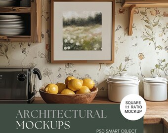 May include: A framed watercolor painting of a field of white flowers with a blurred background of green trees and a light blue sky. The painting is hanging on a wall in a kitchen with a wooden shelf, a toaster, and a bowl of lemons.
