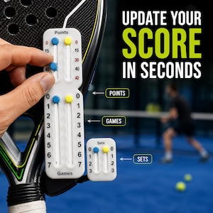 May include: A white plastic padel scorekeeper with blue and yellow sliding markers for tracking points, games, and sets. The device features printed labels for Points, Games, and Sets, with text reading UPDATE YOUR SCORE IN SECONDS on the side.