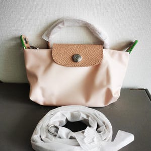 Vintage Pre-Loved Longchamp XS Beutel XS Frauen Handtasche Handytasche