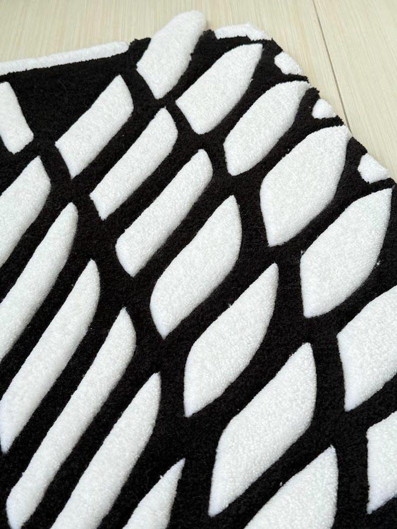 Hand tufted anime rug in irregular shape, bold blue and white wings design, soft textured desk mat