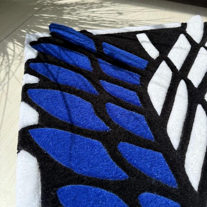 Handmade otaku rug placed near white desk and shelving unit