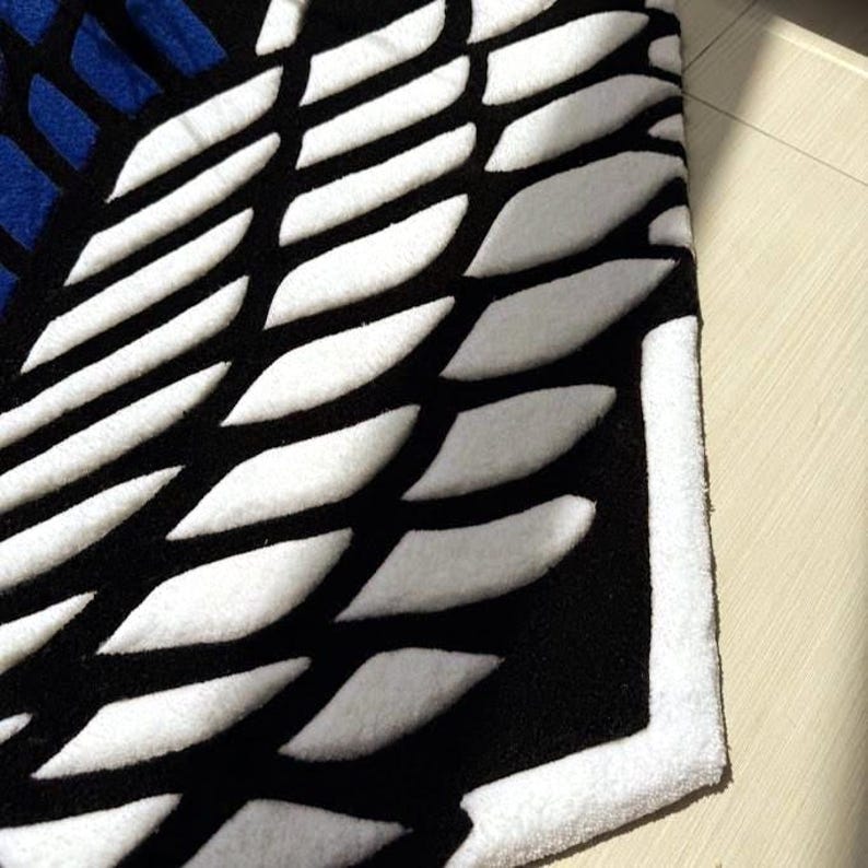 Handmade otaku rug placed near white desk and shelving unit