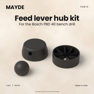 May include: A black feed lever hub kit for the Bosch PBD 40 bench drill, labelled MAYDE PARTS. The kit includes a solid circular knob, a hollow cylindrical component with internal radial ribs, and a small sphere, all made of PETG material.