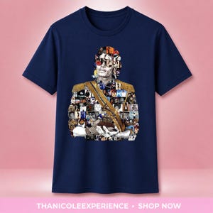 May include: A navy blue short-sleeve t-shirt featuring a central graphic collage of a person wearing sunglasses and a gold military-style jacket with epaulets. The image is composed of numerous smaller photographs arranged to form the figure's silhouette.