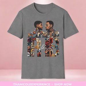 May include: A charcoal gray short-sleeve t-shirt featuring a graphic print of two men facing each other above large block letters R and B. The letters are filled with a collage of musical imagery, including microphones and silhouettes of performers.