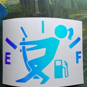 May include: A white sticker with a gradient blue and purple design. The sticker features a person pushing a gas pump nozzle into a car, with the letters "E" and "F" on either side. The design is a humorous take on a fuel gauge.