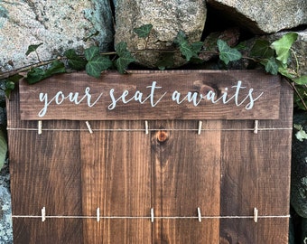 20 Table Your seat awaits seating table card board with twine rows & clips
