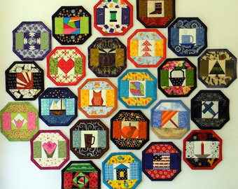 May include: A collection of 20 colorful octagonal fabric coasters with various designs, including a heart, a house, a tree, a cup, a boot, a pumpkin, a candle, a star, a leaf, an owl, a fish, a watermelon, and a Christmas tree.