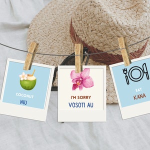 May include: Three Polaroid-style photographs hanging on a string with clothes pegs. The first photo shows a coconut with a straw, the second photo shows a pink orchid, and the third photo shows a fork and plate with the text "Eat Kana".