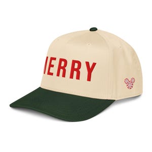 May include: A cream-colored baseball cap with a dark green brim. The word "MERRY" is printed in red across the front. A small design of three red and white peppermint candies is on the side.
