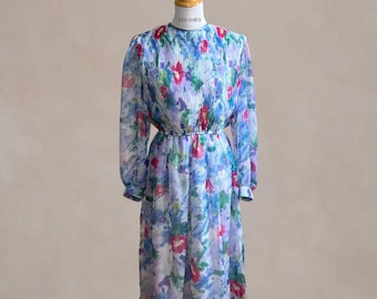 Sukienka Lisa Michaels z kwiatowym wzorem w stylu vintage z lat 80., dopasowana i rozkloszowana, rozmiar L, wyprodukowana w USA, niebieska