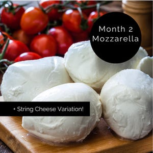 May include: A close-up of fresh mozzarella cheese balls on a wooden cutting board, with red cherry tomatoes in the background. The image includes text that reads "Month 2 Mozzarella" and "+ String Cheese Variation!"