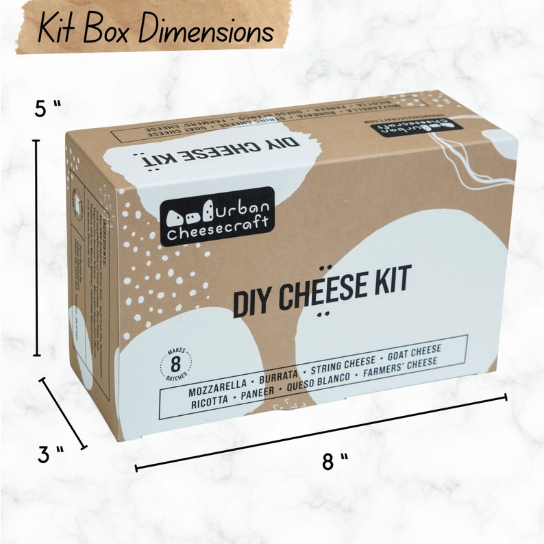 May include: A brown cardboard box with white text and graphics. The box is labeled "DIY Cheese Kit" and lists the types of cheese included: mozzarella, burrata, string cheese, goat cheese, ricotta, paneer, queso blanco, and farmers' cheese. The box measures 8 inches long, 5 inches tall, and 3 inches wide.