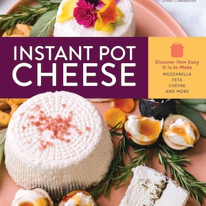 May include: A close-up of a white cheese log with pink salt on top, surrounded by fresh figs, rosemary sprigs, and flowers. The text "INSTANT POT CHEESE" is in large, bold letters on a purple background. The text "Discover How Easy It Is to Make MOZZARELLA FETA CHÈVRE AND MORE" is in white text on a yellow background.