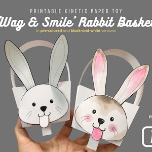 May include: Two paper rabbit baskets with long ears and smiling faces. The text "Wag & Smile Rabbit Basket" is at the top. The image also includes the text "in pre-colored and black-and-white versions", "PDF Format 300 DPI", and "Paper Size A4".