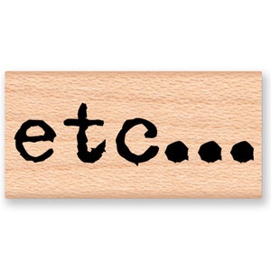 May include: Wooden stamp with the text "etc..." in black ink.