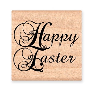 May include: Wooden stamp with the text "Happy Easter" in a decorative script font.