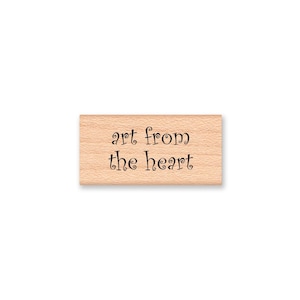 May include: Wooden stamp with the text "art from the heart" in a decorative font.