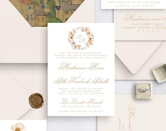 May include: Elegant wedding invitation suite with cream-colored stationery. The suite includes invitations, RSVP cards, and envelopes. The envelope liner features a landscape painting. Gold script and floral accents add a touch of sophistication. A ring box and wax seal are also included.