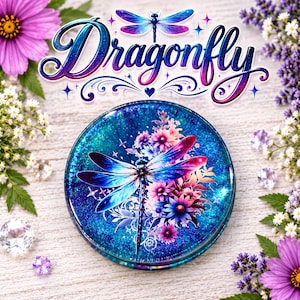 May include: A circular decorative item featuring a vibrant blue and purple galaxy-inspired background with a central dragonfly graphic surrounded by colourful flowers. The word Dragonfly is written in a stylised script font above the circular object.