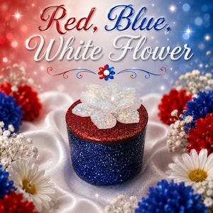 May include: A cylindrical container with a deep blue glitter base and a vibrant red glitter lid, topped with a translucent, iridescent white flower. The text "Red, Blue, White Flower" appears above the object in a decorative script font.