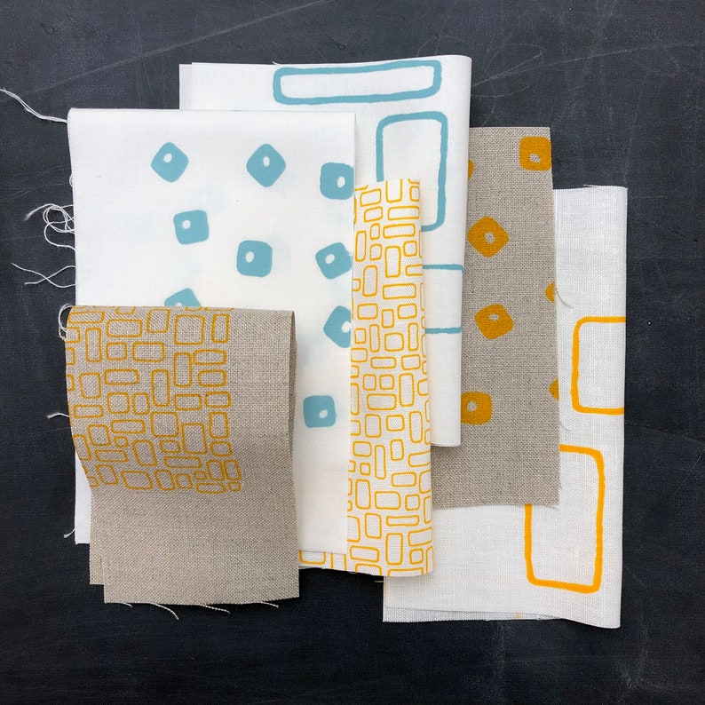 sample packs hand screen printed fabrics on linen and cotton duck egg, yellow