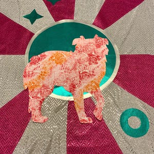 May include: A pink and orange floral patterned dog silhouette on a teal background with a silver and pink sparkly background.