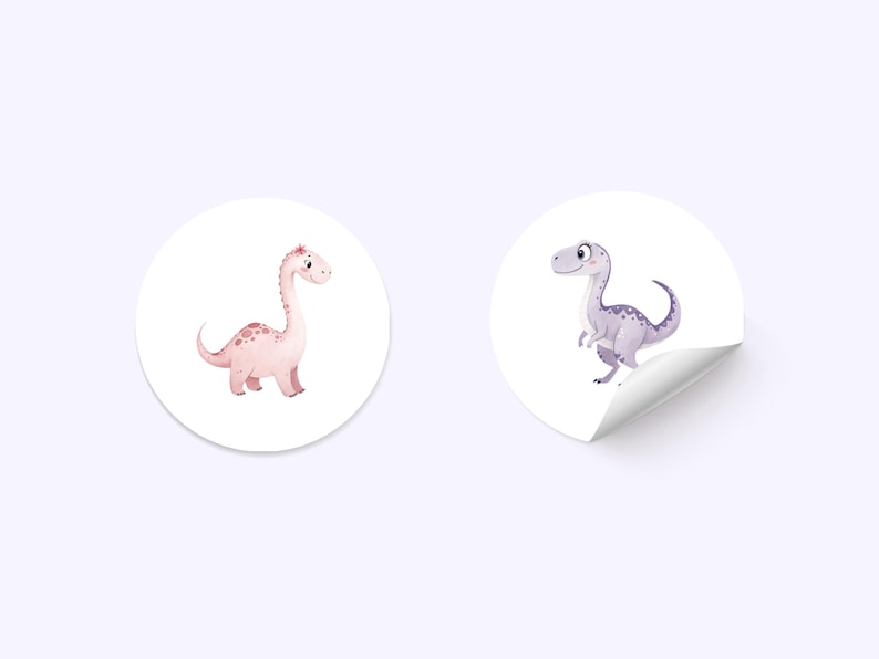 May include: Two round stickers featuring cartoon dinosaurs. The first sticker has a pink dinosaur with a long neck and a spotted pattern. The second sticker has a purple dinosaur with a short neck and a spotted pattern.