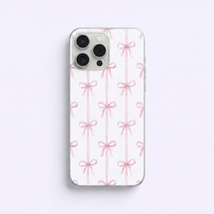 May include: A smartphone case featuring a repeating pattern of pink bows on a white backdrop. The bows are arranged vertically, creating a delicate design. The case has a clear border.