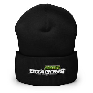 May include: Black beanie with the text "FCRHL DRAGONS" in white and green. The beanie is a winter hat, likely made of a soft, warm material. The hat is a solid black color.