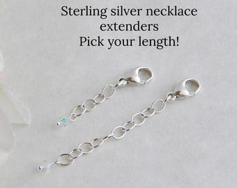 May include: Two sterling silver necklace extenders with lobster claw clasps and small clear crystal accents at the ends. The text above the extenders reads: Sterling silver necklace extenders. Pick your length!