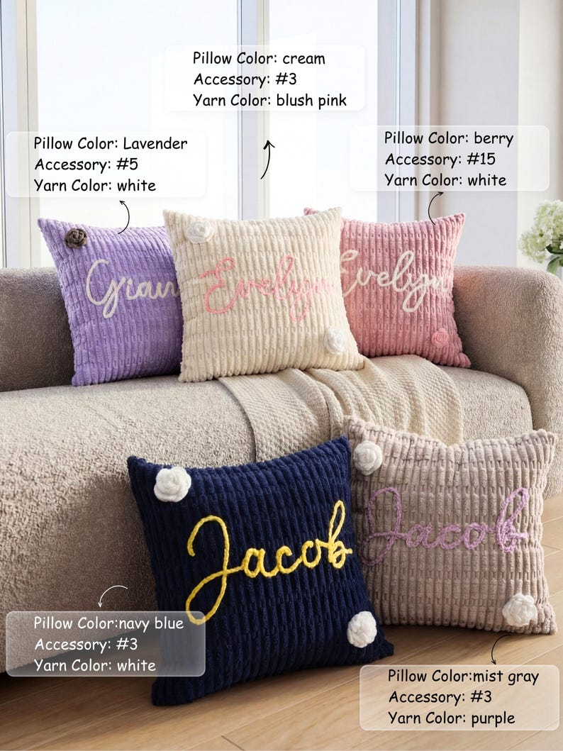 May include: Five square textured pillows in lavender, cream, berry, navy blue, and mist gray. Each pillow features a custom name in cursive yarn script and small floral accents. Text labels indicate pillow color, accessory number, and yarn color.