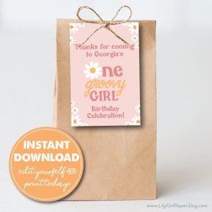 May include: A pink and white printable favor tag with daisies and the text "Thanks for coming to Georgia's One groovy girl Birthday Celebration!"