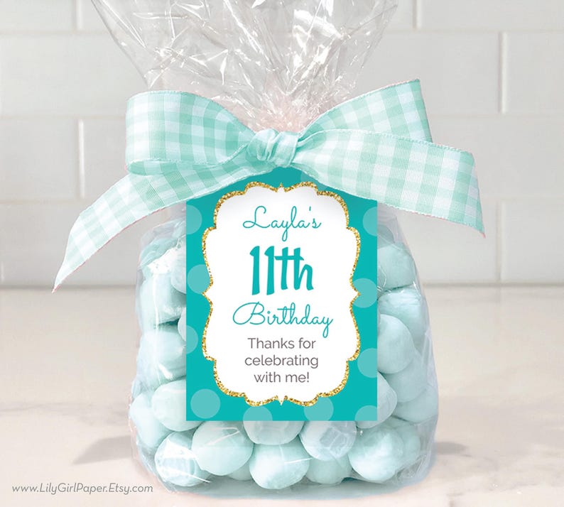 May include: Teal and gold birthday favor tag with white polka dots and the text "Layla's 11th Birthday Thanks for celebrating with me!"