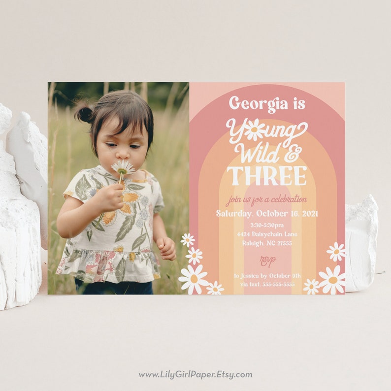 May include: A pink and orange birthday invitation with a photo of a young girl blowing on a dandelion. The invitation says "Georgia is Young Wild & Three" and includes details for the party, including the date, time, and location. RSVP by October 9th.