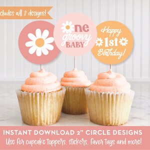 May include: Three 2 inch round printable cupcake toppers with a retro 70s theme. The first topper is pink with a white daisy. The second topper is pink with the text "one groovy baby". The third topper is orange with the text "Happy 1st Birthday!"