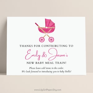 May include: Pink and white baby shower sign with a pink stroller illustration. The sign says "Thanks for contributing to Emily & Jason's New Baby Meal Train! Please leave cold items in the cooler. We look forward to introducing you to baby Stella!"