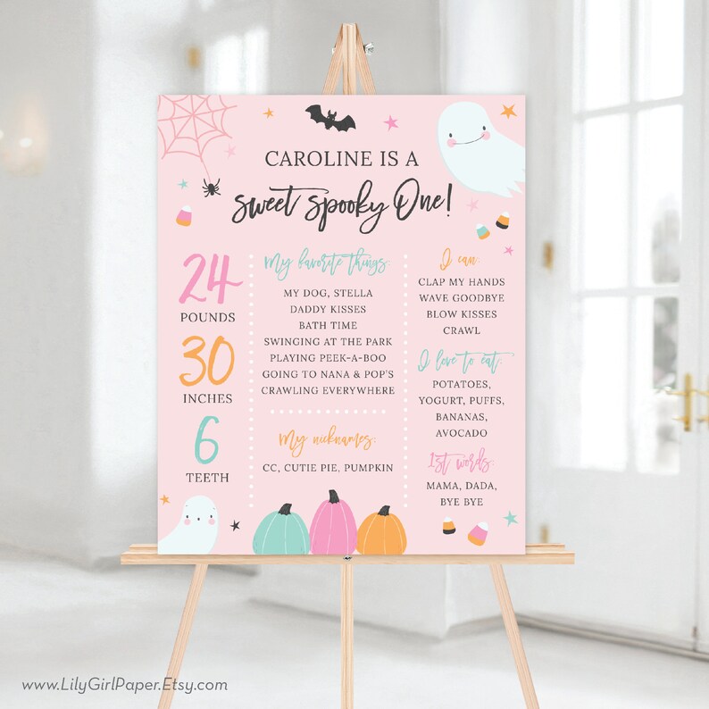 May include: A pink and white printable sign with a ghost and pumpkins. The sign says "Caroline is a Sweet Spooky One!" and includes details about the child's age, weight, height, and favorite things.