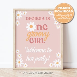 May include: A pink and white printable sign with daisies and the text "Georgia is one groovy girl. Welcome to her party!"  The sign is framed in a light wood frame.  The text "Instant Download. Edit yourself and print today!" is in a yellow box in the top right corner.  The text "www.LilyGirlPaper.Etsy.com" is at the bottom of the sign.