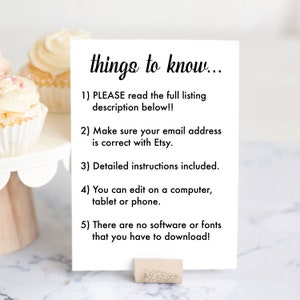 May include: A white card with black text on a wooden stand. The text reads "things to know..." and lists five instructions for buyers. The card is sitting on a white cake stand with cupcakes.